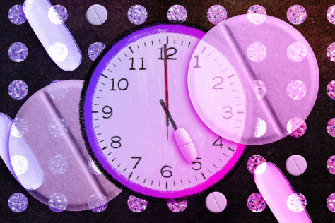 pink and purple clock against a grid of pills