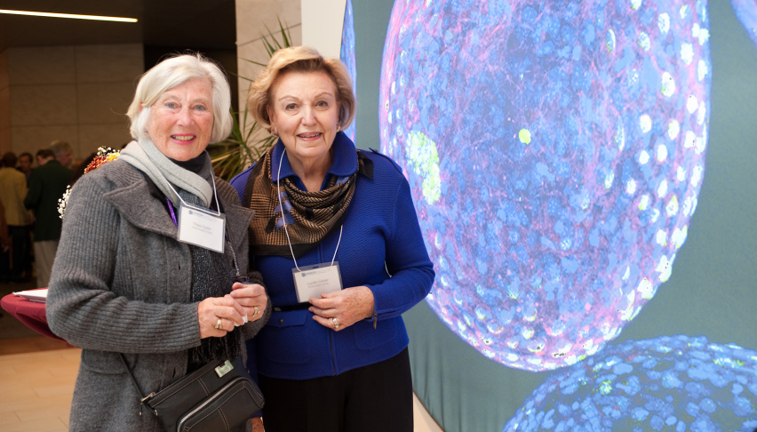 two women in front of a scientific image in the KI Public Galleries