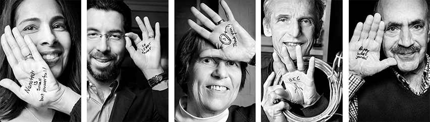 five black and white portraits of MIT scientists holding up their hands with words and images written on them