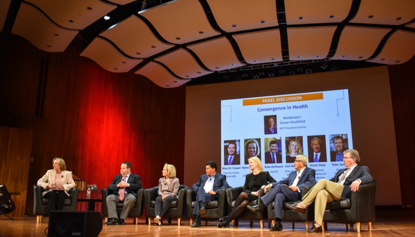 a panel of scientists on stage