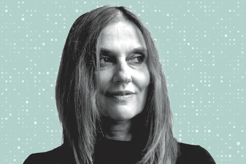 Black and white headshot of Regina Barzilay on an aqua background