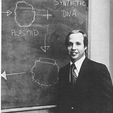 Bob Swanson in front of science diagram