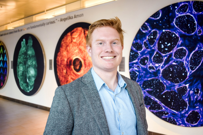 Photo of Matt Jones in the Koch Institute Public Gallery. 