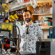 Alex Shalek surrounded by lab equipment