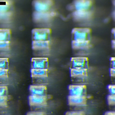 Very tiny translucent boxes with light blue material inside.