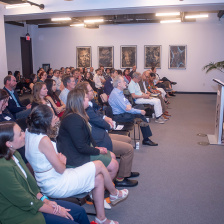 A man speaks to an audience