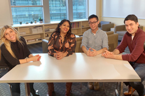 Kate Koch, Susy Ramos, Yunpeng Liu, and Greg Ekchian around a table