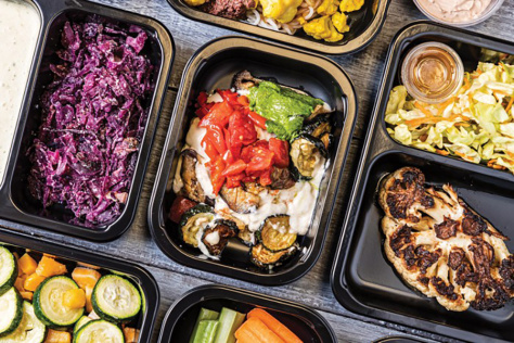 trays of colorful vegetables and sauces