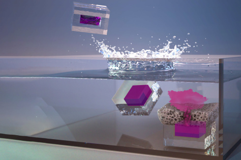 cube-like capsules fall into liquid and release a splash of dye