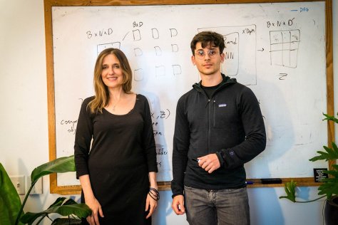 Regina Barzilay and Adam Yala standing in front a whiteboard