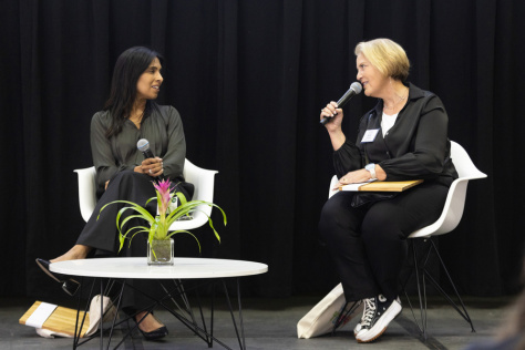 Sangeeta Bhatia and Michal Preminger sit on stage in conversation.