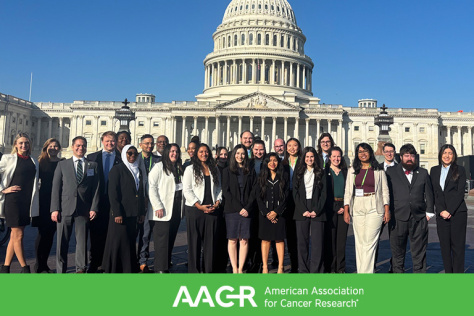 Photo of group of people standing in front of the U.S. Capitol Building 