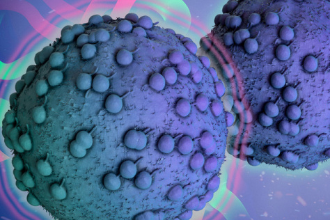 Two tumor cells, one with forcefield. two blue spheres with green and purple spheres on them