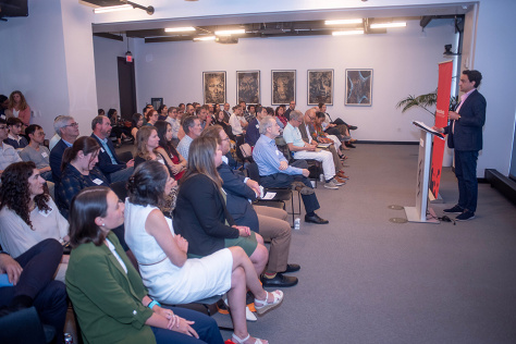 A man speaks to an audience