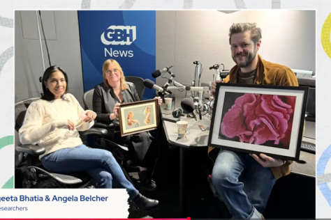Three people sitting in the WGBH News studio. There is a text box at the bottom with the names of the guests: Sangeeta Bhatia and Angela Belcher and the text in the upper right hand corner says The Curiosity Desk