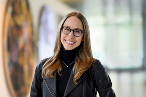 Headshot of Jessica Stark, wearing a black turtleneck sweater and black jacket