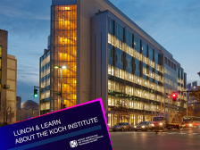 The Koch Institute building lit up at dusk