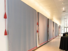 draped displays in an empty gallery, awaiting visitors